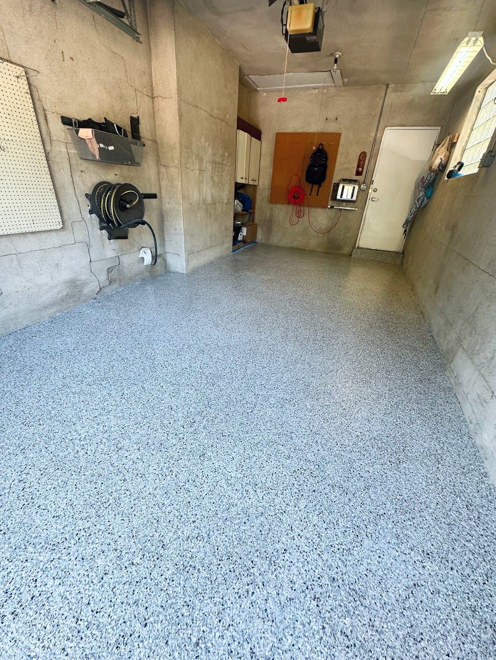After: finished flake epoxy floor in the same garage